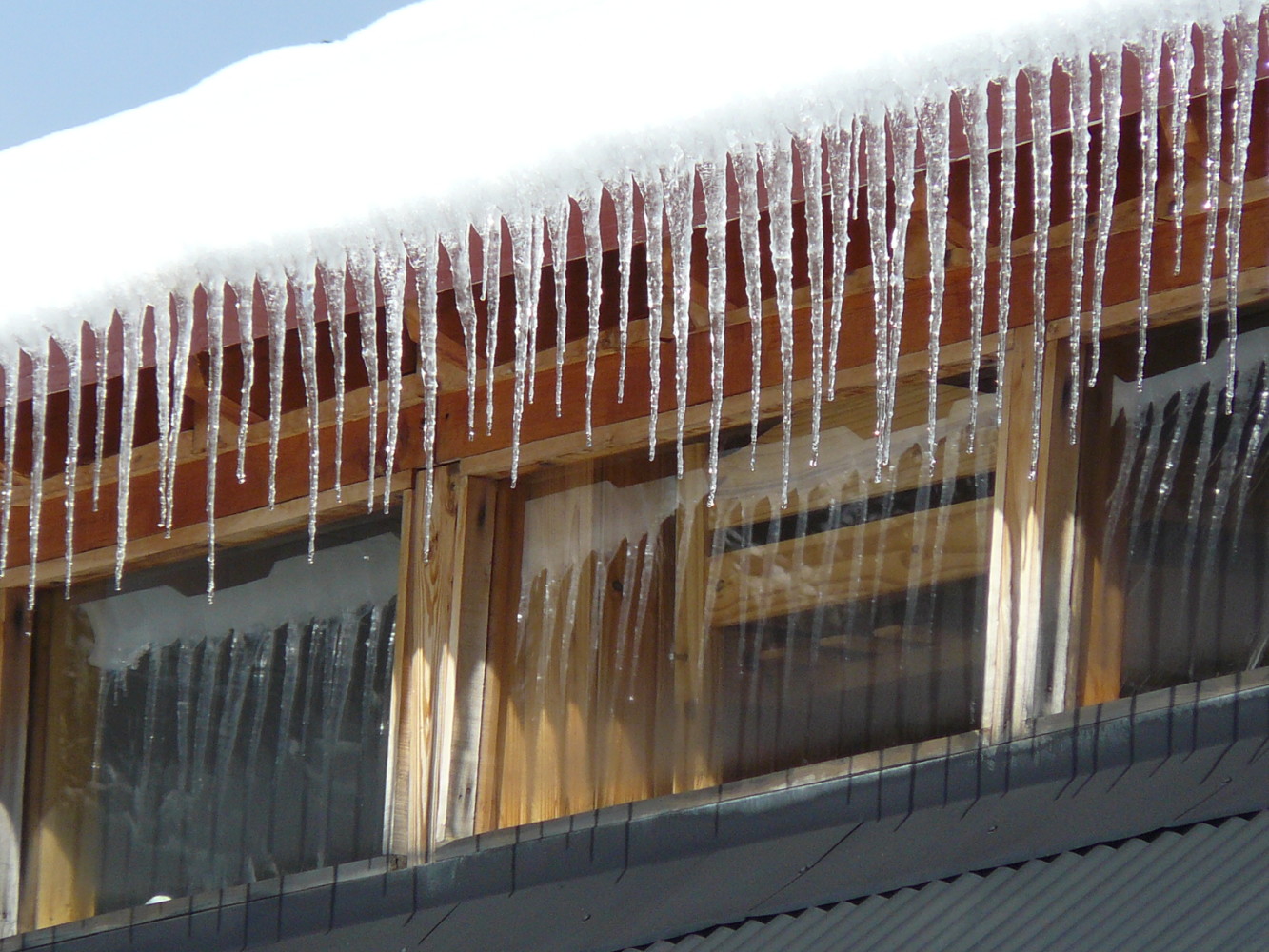 Photo of House roof with snow and ice